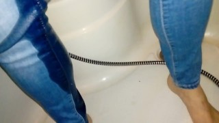 Slim polish milf pissing in blue jeans