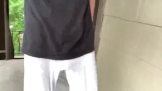 Freeballing in grey sweats showing VPL 