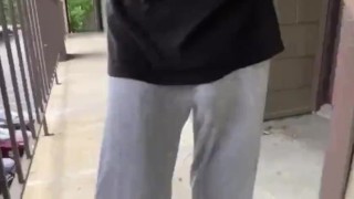 Freeballing in grey sweats showing VPL 