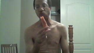 BLACK GAY STICKS CARROT IN ASS AND EATS IT