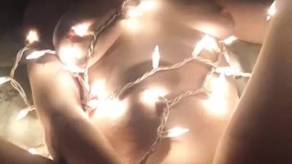 Catgirl plays with xmas lights