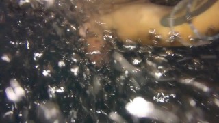 Twink tries hydromassage nozzle on his uncut cock in public pool underwater