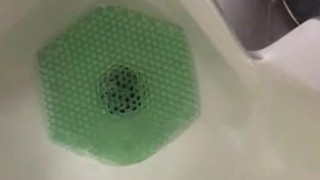 Almost Caught in action at the urinal Pinching off/on Janitor saw wet floor