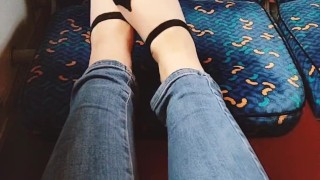  plays with her feet in the train. Public foot fetish