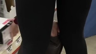 Candid following sexy cougar MILF in tight yoga pants who teases her ass