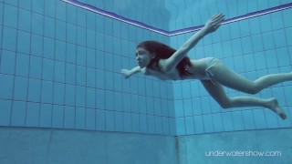 Roxalana submerged in the pool naked