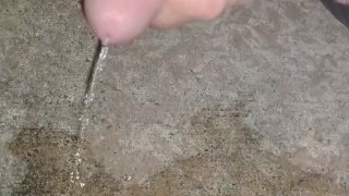 Stroking and peeing outside