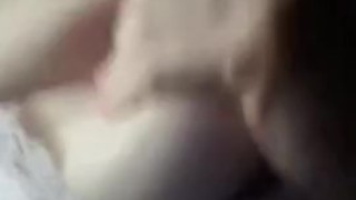 Moaning while playing with my tits. 