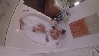 Stacked MILF masturbating in bathtub
