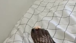 sexy feet in fishnets stroking dildo