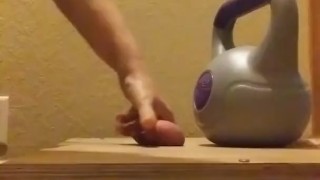 Wife crushes balls with kettle bells