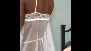 Black Teen twirls in white lingerie