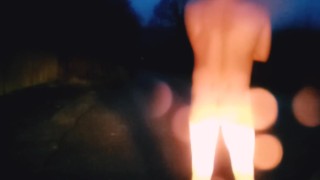 Standing naked in the road waiting for cars 