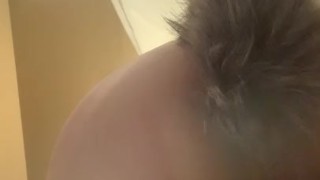 Tattooed girl plays with wolf tail