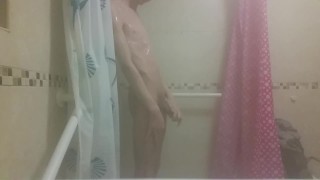 Hot very skinny guy with flat butt strokes his wet cock and pisses
