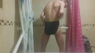 Hot very skinny guy with flat butt strokes his wet cock and pisses