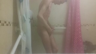 Skinny boy strokes his big wet cock after shower