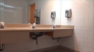zentai snake showing cock in public bathroom