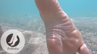 Playfull feet underwater