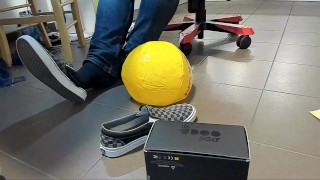 Male Shoeplay with beach ball in Under Armor, Vans Slip Ons, Black Socks