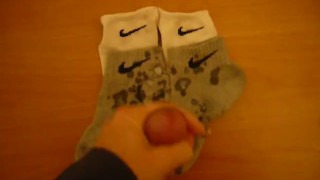 Jerk off and cum over four Nike socks