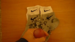 Jerk off and cum over four Nike socks