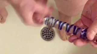 Foreskin docking/stroking using glass dildo then cum on dildo & suck clean.