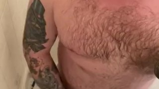 Bearded stud takes shower