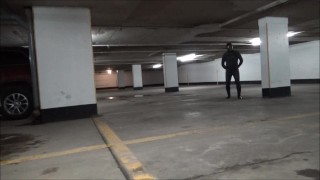 wetsuited & masked in parking garage