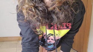 Brown eyed curly hair in hoody playing with self