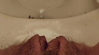 Close up Hairy Ginger Pussy pissing on toilet