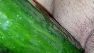 Masturbating with a cucumber