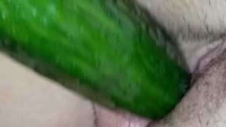 Masturbating with a cucumber