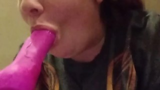 Gagging on a dildo