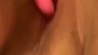 Toying her pink pussy