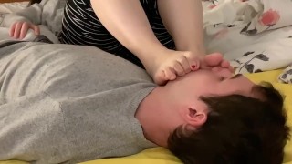 Girlfriend’s feet on my face in bed