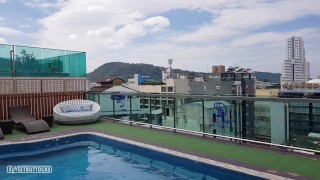 Girl with red hair sunbathes without panties by the pool