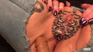 KinkyFrida in jeans plays with her pierced and tattooed pussy