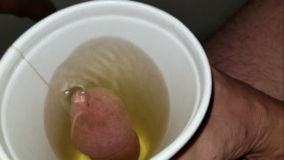 pissing in a cup from the bottom and letting it drip down my balls