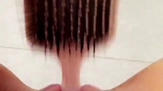 Naughty teen fucks her tiny pussy with hairbrush in school bathroom