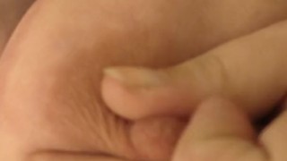 Girl with colored hair plays with her big fat tits