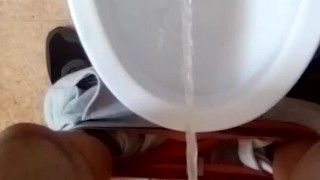Pissing in toilet