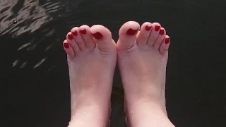 tici_feet tici feet @tici_feet my feet with red toenails in lagoon
