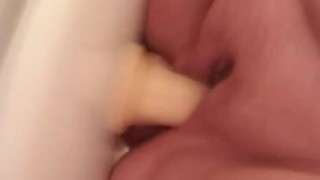 Chubby chick bounces on dildo