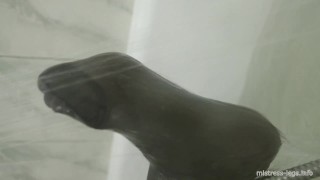 Black stockings in the bathroom and under the shower