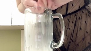 Sexy milf in lingerie squirting breastmilk into cup