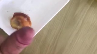 Adding the sauce to her breakfast 