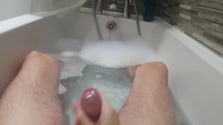 Stroking my hard cock in the bath and spurting cum