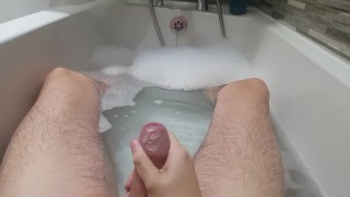 Stroking my hard cock in the bath and spurting cum