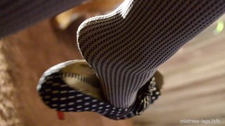 Mistress legs in opaque grey pantyhoses